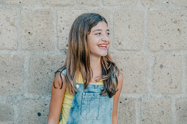 istock Girl leaning against wall 488677274
