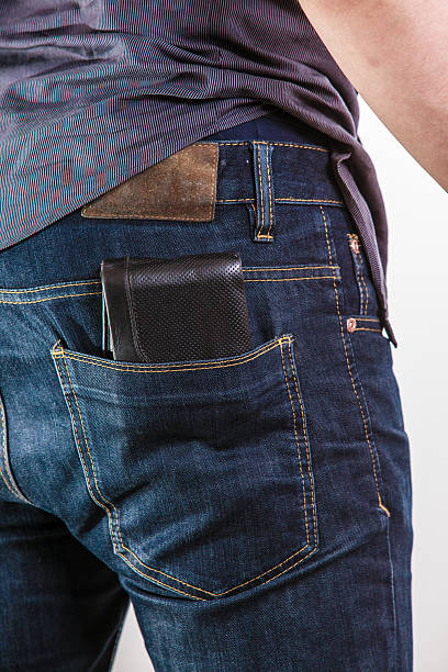 istock Closeup. Careless man with wallet on back pocket. Theft. 488686929