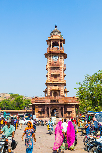 Jodhpur, India - October 23: people hurry at the Sadar market at the clocktowe in Jodhpur, India. The imposing Clock Tower was built by Maharaja Sardar Singh (1880-1911).