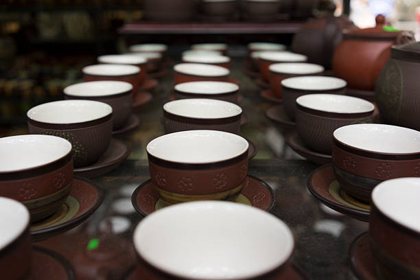 Cups in rows Three rows of baked-clay cups bat trang stock pictures, royalty-free photos & images