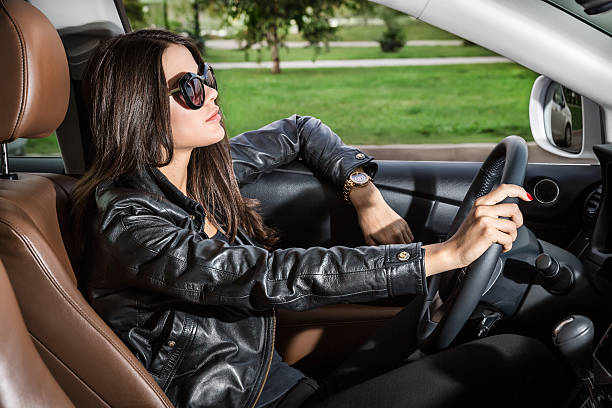 istock The girl behind the wheel of a car. 488687708