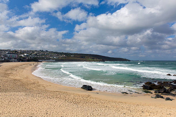 istock St Ives beach Cornwall at Porthmeor waves and blue sky 488688811