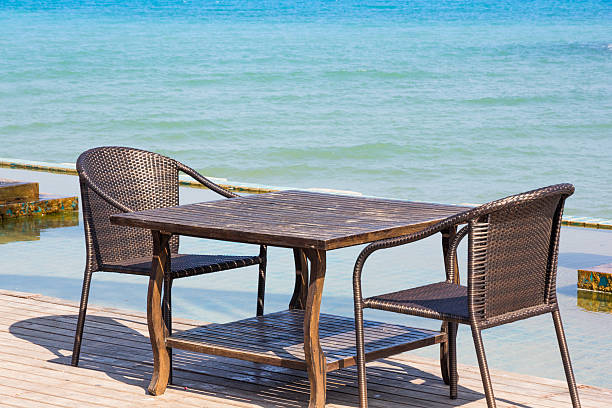 istock Table chair beside sea 488690287