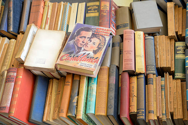 Old books for sale Barcelona, Spain - March 12, 2014: Old books for sale in the most famous flea market in Barcelona, also known as Els Encants or Els Encants Vells, located in Glories neighborhood. humphrey bogart stock pictures, royalty-free photos & images