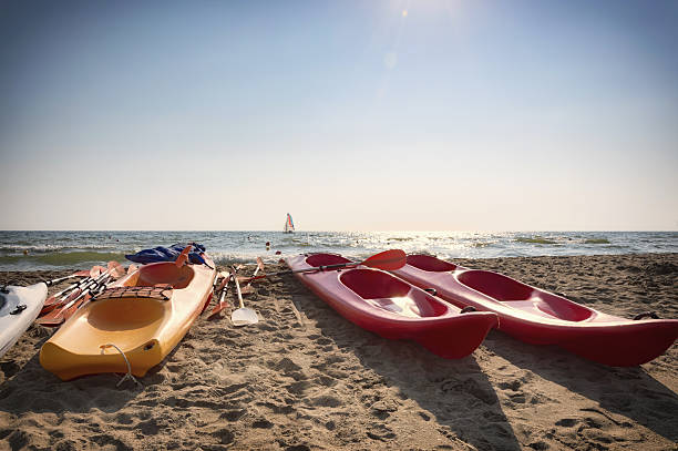 istock colorful kayak and sailboat 488691834