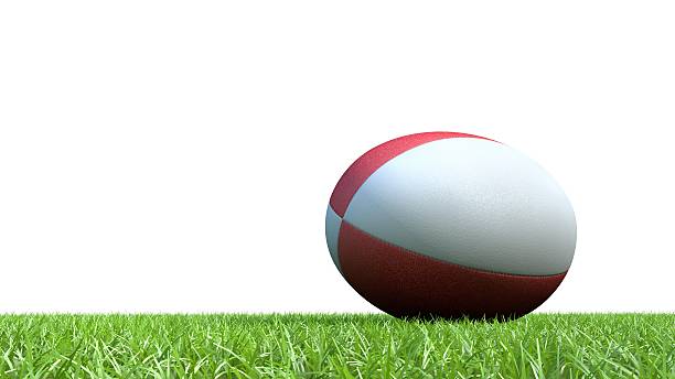 istock Red rugby ball on grass V03 488692848