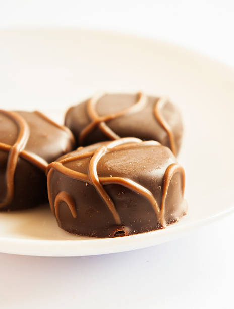 istock Tasty chocolate bonbon isolated on a white background 488693939
