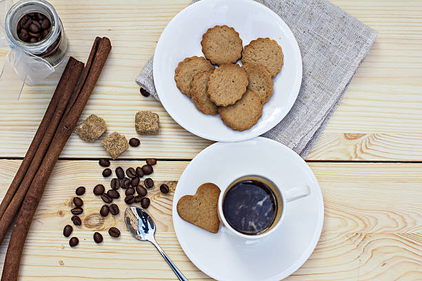 istock Ginger biscuits, cinnamon, a cup of hot coffee. 488694062