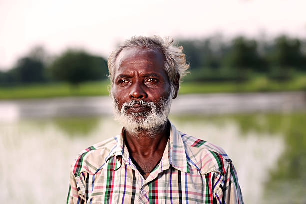 Bright smiling indian senior man in the streets of Delhi. Edited, Squared. Real People Portrait, New Delhi, India.