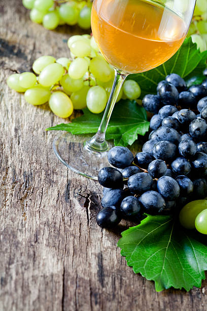 istock Glass Of White Wine And Grapes 488708410