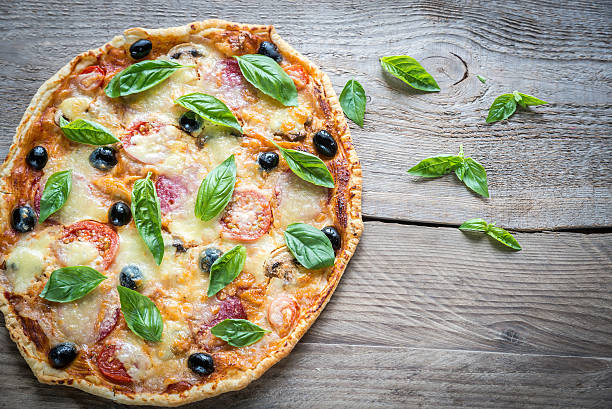 istock Pizza on the wooden board 488708884