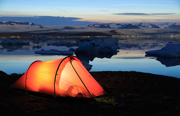 Red tent at dusk near the famous Jokulsarlon lagoon on Iceland.