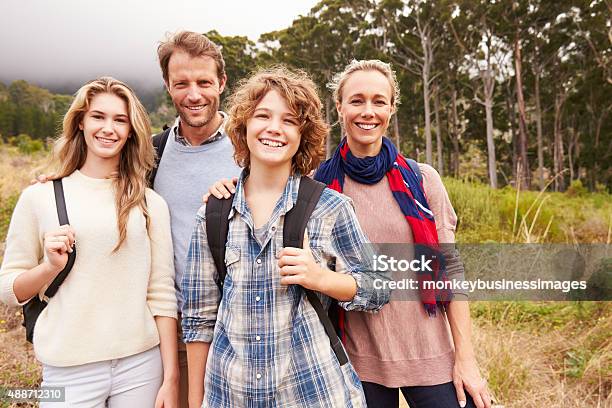 Happy Family Outdoor Portrait In A Forest Stock Photo - Download Image Now - Family, Teenager, Parent