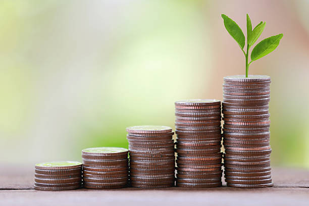 istock silver coin stack and treetop in business growth. 488715022