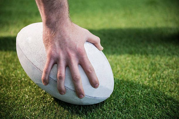 istock Rugby player posing a rugby ball 488716262