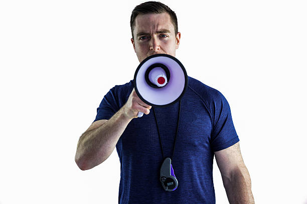 istock Male trainer yelling through the megaphone 488716742