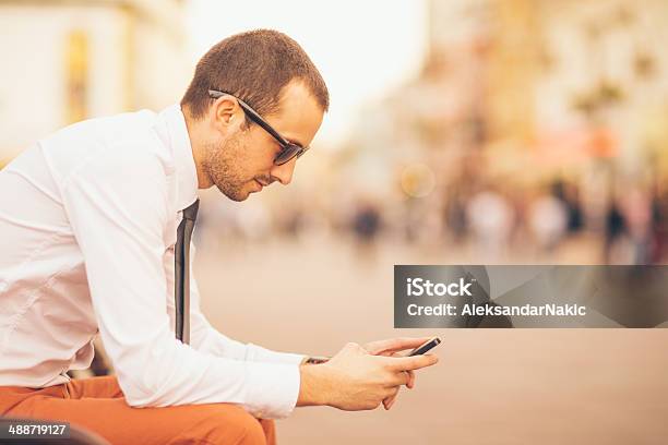 Using A Smartphone On The Street Stock Photo - Download Image Now - 25-29 Years, Adult, Adults Only