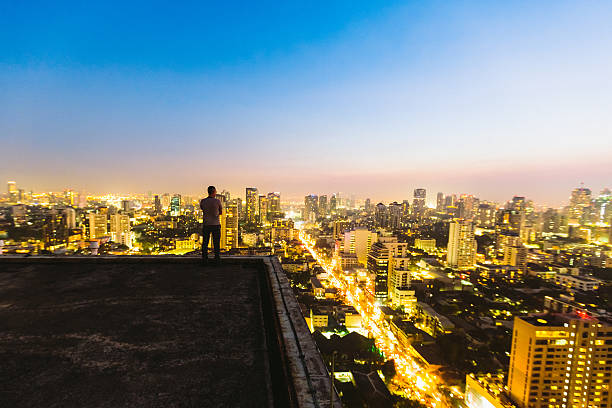 istock Man on top of skyscraper 488719193