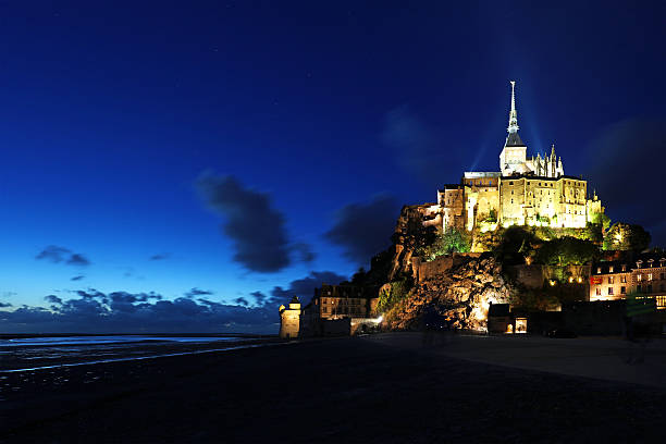 istock Mont Saint Michel Lit in the Dark 488719396