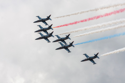 Lakewood, United States- July 21, 2012:  Joint Base Lewis-McChord opens its gates to the public for a free airshow.  This image shows the civilian Patriots Jet Team flying over the airshow.