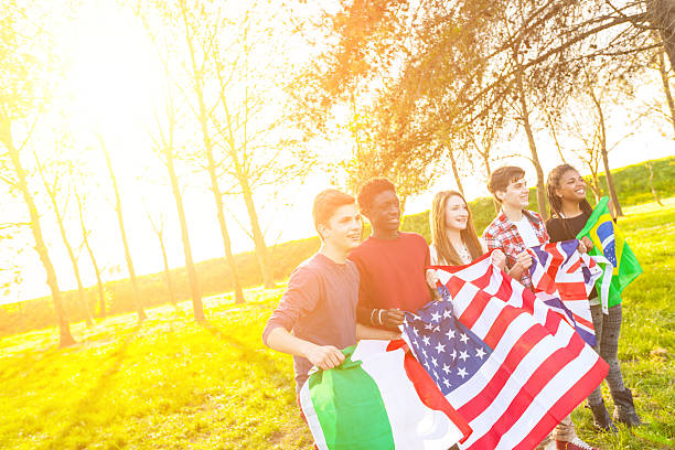 istock Teenage Friends Holding Flags from different Countries 488720699