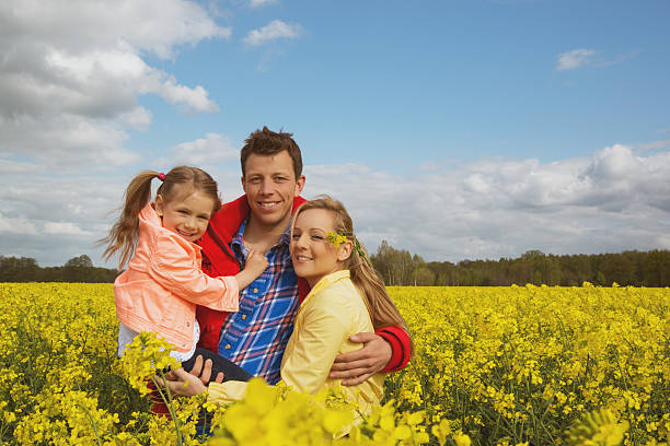 istock happy family outdoor in rape field 488720877