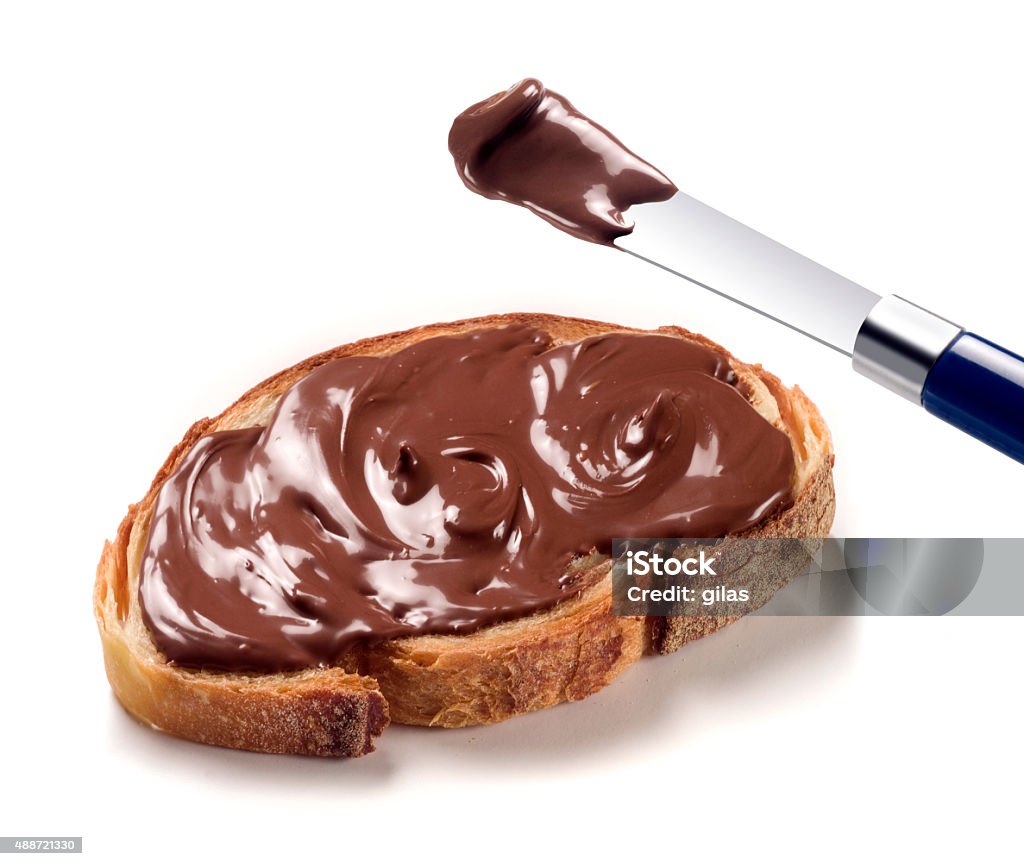 Slice of bread with chocolate cream Spread a slice of bread with chocolate cream Chocolate Stock Photo