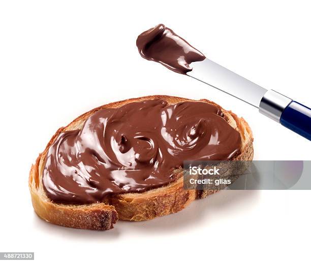 Slice Of Bread With Chocolate Cream Stock Photo - Download Image Now - Chocolate, Spreading, Chocolate Spread