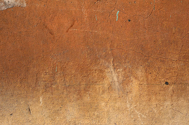 istock Texture of old wall covered with brown stucco 488721918