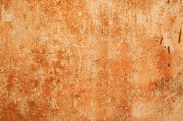 istock Texture of old wall covered with brown stucco 488722120