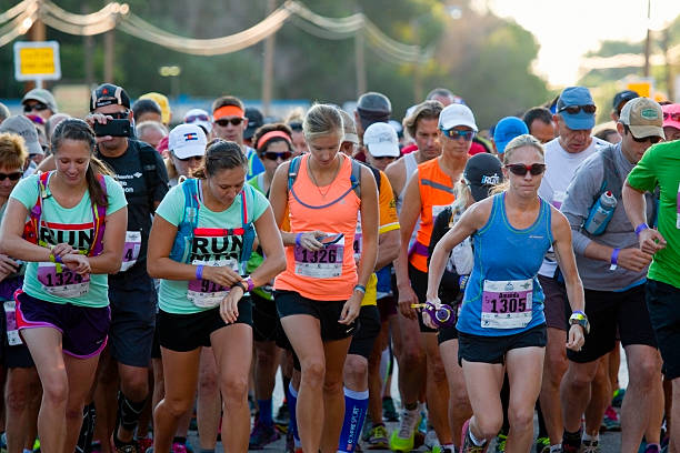 Pikes Peak Marathon and Ascent Race Start Manitou Springs, Colorado, USA - August 15, 2015: Runners compete in a rugged race up 14,115 foot Pikes Peak on the Barr Trail near Manitou Avenue in Manitou Springs Colorado track and field fans stock pictures, royalty-free photos & images