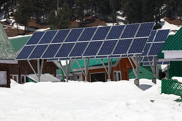 solarcells on a winter with snow mountain