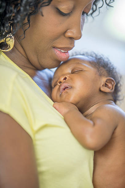 istock Baby Sleeping on Mother's Chest 488722974