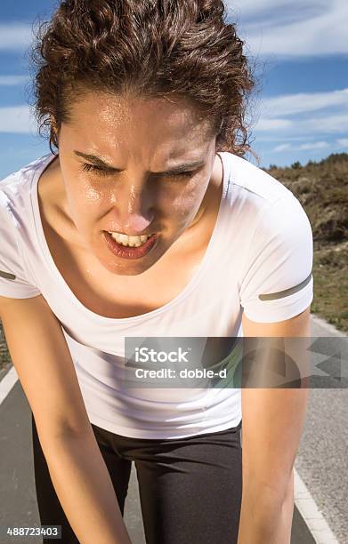 Tired Runner Girl Sweating After Running With Sun Stock Photo - Download Image Now - Active Lifestyle, Activity, Adult