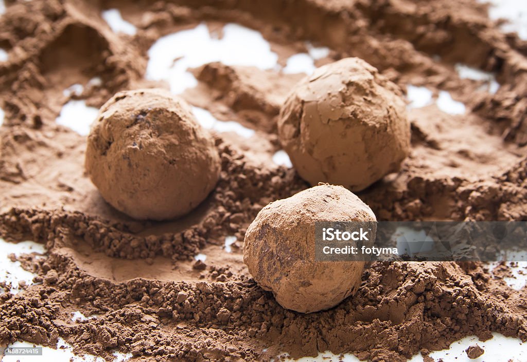 chocolate truffles rolling homemade chocolate truffles in cocoa powder Baked Pastry Item Stock Photo