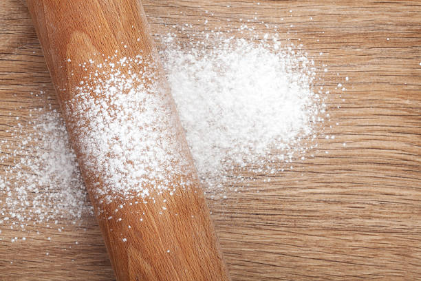 istock Rolling pin with flour on wooden table 488725205