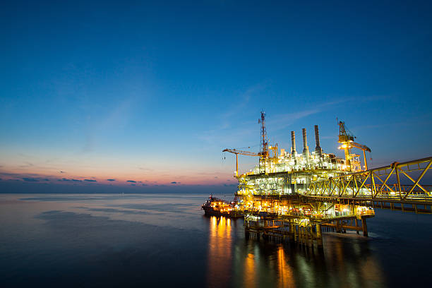 istock oil and gas platform in sunset or sunrise time. 488726563