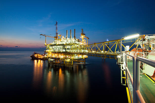 istock Oil and gas platform in sunset or sunrise time. 488726593