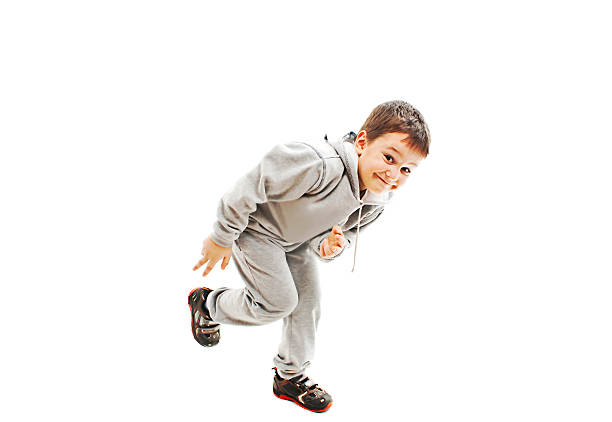 Child boy climbing wall on playground