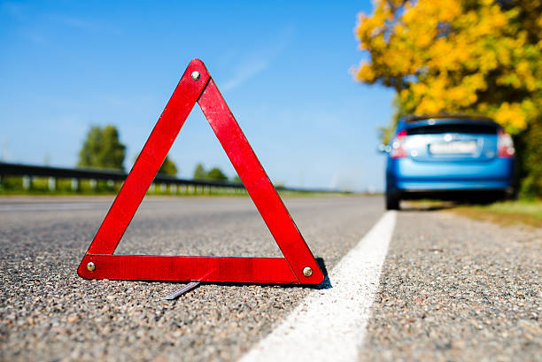 istock sign emergency stop on the blue car background 488755088