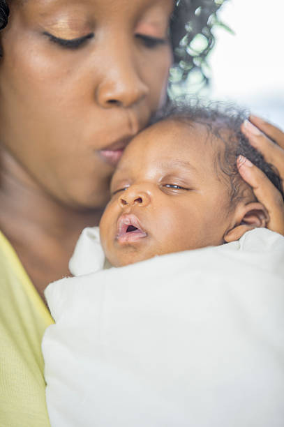 istock Mother Kissing Her Small Child 488755288