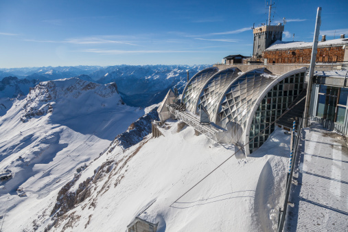 On the summit of the Zugspitze, the highest mountain in Germany, is this building which houses restaurants, gift shops, ski facilities, a museum and the mechanical support for several cable cars.  It also shares the summit with another facility on the Austrian side of the border just a few feet away.