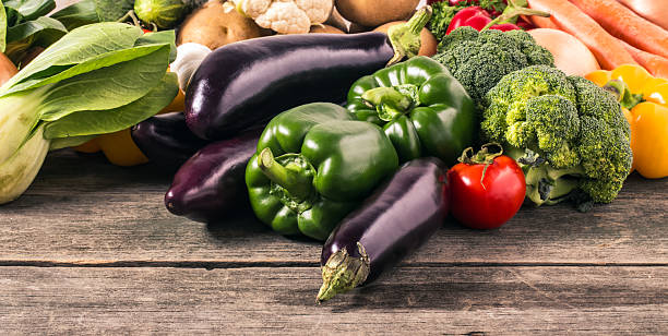 istock Vegetables on wood background. Organic food. 488758565
