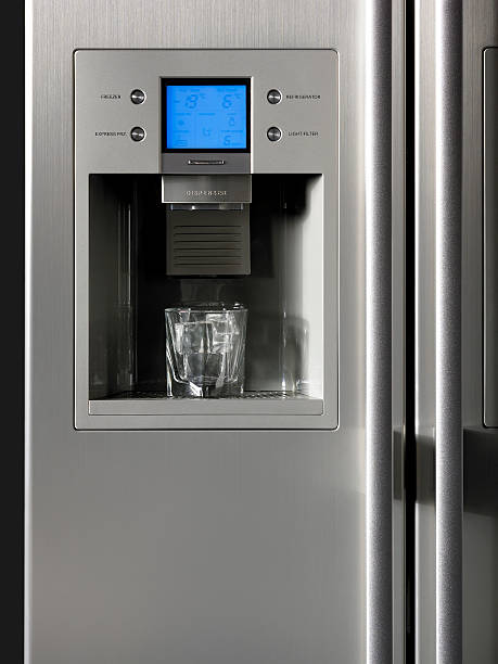 istock Fridge detail with ice dispenser and glass 488758605