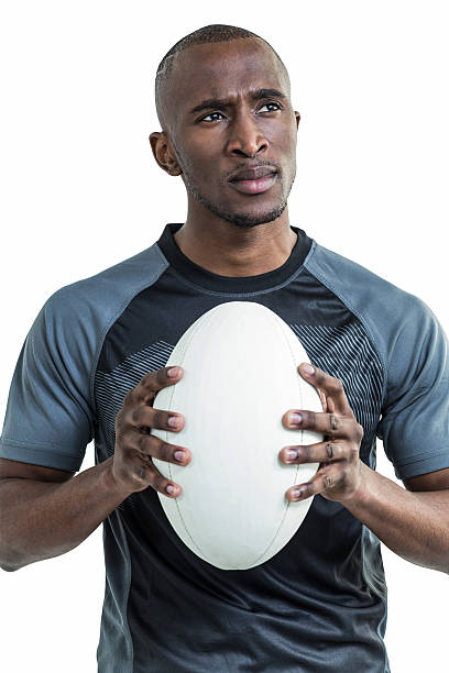 istock Thoughtful athlete holding rugby ball 488758782