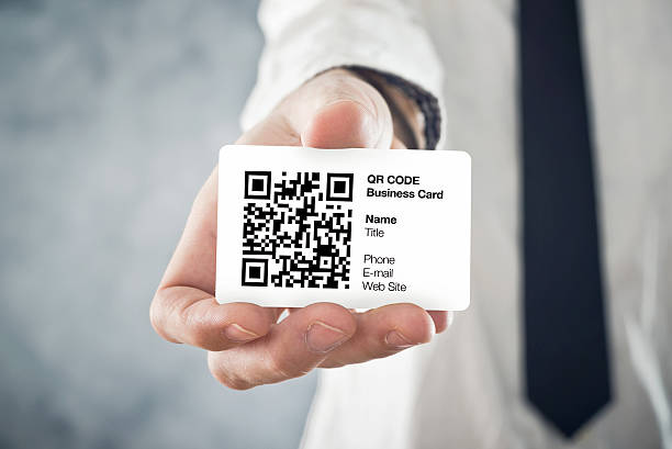 istock Businessman holding QR code business card 488759447