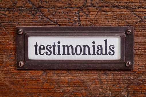 testimonials  - a label on a grunge wooden file cabinet