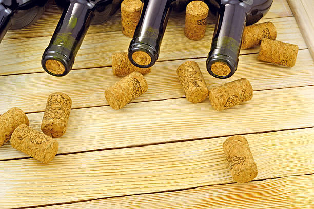 istock Wine bottles on background wooden slats 488760105