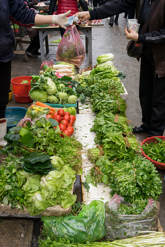 Trading action for vegetable at street market