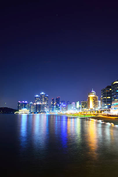 istock skyline at night with Haeundae district in Busan, South Korea 488760663